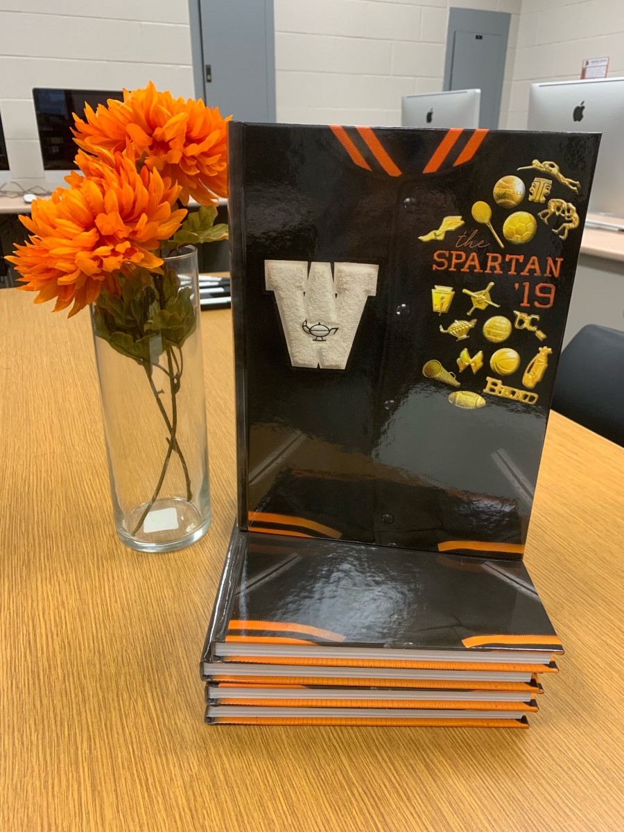 image of a book with orange flowers in a vase